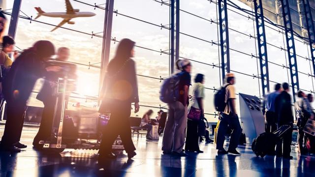 Passengers queue for a flight in Malaysia. Photo credit: iStock/06photo