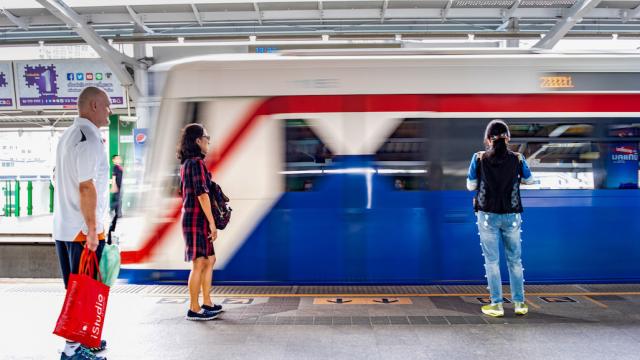 People waiting for the train in Thailand