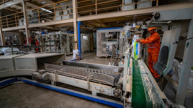 A man works at a factory in Cambodia.